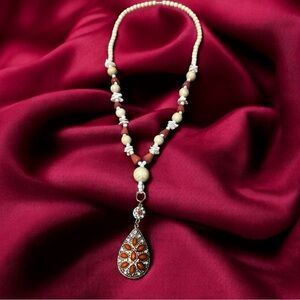 Navajo inspired beaded necklace coral colored pendant